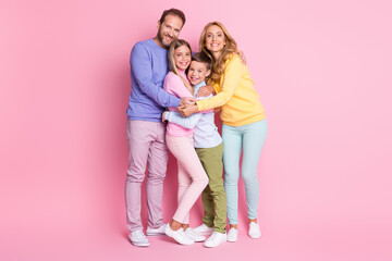 Poster - Full size photo of positive cheerful family daddy mommy hug little boy girl isolated over pastel color background