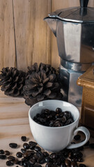 Wall Mural - Coffee beans in white cup on wood table for food and drink content.