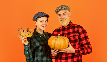 thanksgiving day with pumpkin. vintage family couple. food and harvest. happy man and woman checkere