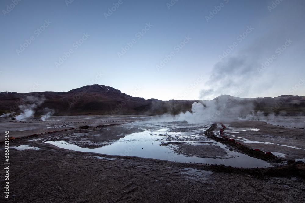 Pre-dawn light on the Geysers del Tatio (El Tatio), the third largest ...