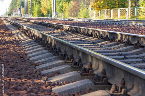 Cuadros en Lienzo Railroad tracks with concrete sleepers stretching far beyond the horizon