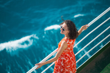 A woman is sailing on a cruise ship