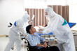© Thirawatana - A doctor in protective clothing is testing a patient's virus in a hospital examination room..