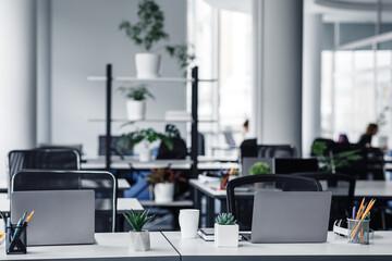 Office interior with white columns and panoramic windows in modern loft