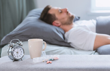 Aufkleber - Sleeping Pills Lying Near Alarm-Clock While Man Sleeps In Bed