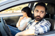 © Hazal - angry man mad at woman after fighting, sitting in car