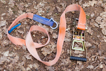 Equipment for slackline Slackline sling next to the machine and protection for the tree. stretched colored slackline in the autumn forest
Sports a tightrope or slackline outdoor in a city park.