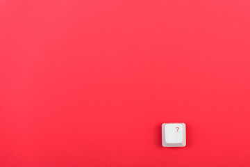 Poster - Keyboard key with question mark isolated. White keyboard key on red background. Top view. Close up