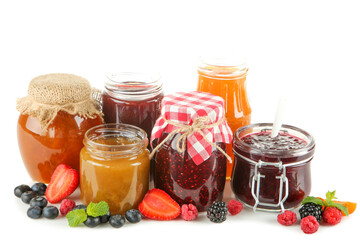 Canvas Print - Sweet jam in glass jars and ripe berries isolated on white background