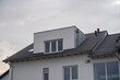 modern semi-detached house with flat roof dormer with aluminum cladding