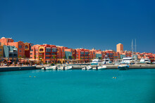Panoramic Seascape On Colorful Marina Promenade Street From Red Sea With Moored Motor Yachts. Marina, Hurghada, Egypt