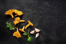 Top View Of Mushrooms Chanterelles On Black Background