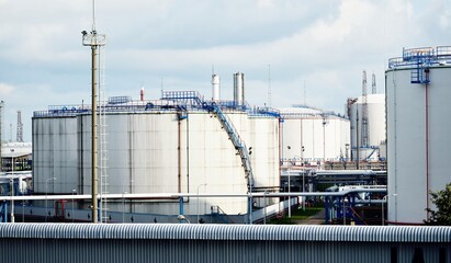 Oil storage tanks at Ventspils terminal on a clear summer day, Latvia