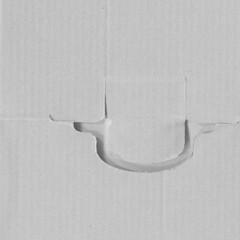 White vintage rough sheet of carton. Recycled environmentally friendly cardboard paper texture. Simple gray minimalist papercraft background.