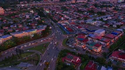 Wall Mural - Aerial footage of local lifestyle people back from work during twilight sunset in Luyang district Kota Kinabalu City, Sabah, Malaysia