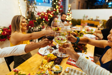 Christmas in Brazil. Family toasting at Christmas dinner.