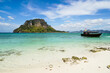 © Good Vibrations Images/Stocksy - Beutiful tropical island and longtail boat