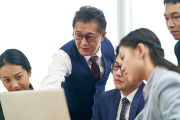 group of asian business people meeting in office