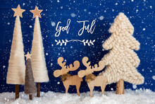 Swedish Calligraphy God Jul Means Merry Christmas On Blue Background With Snow. Decoration And Ornament Like Christmas Trees And A Moose Couple With Snowflakes.
