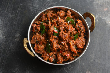 Canvas Print - Traditional homemade Mutton curry from Asian cuisine.   Chukhandar gosht. Spicy delicious meat beef curry.  Bowl of tasty mutton roast Indian spices.  side dish of Ghee rice, Appam, Parotta, Puttu