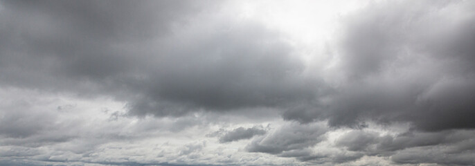 Wall Mural - Image of a dark and cloudy sky during the day