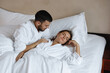 © olgasparrow - Young cute couple, man and woman in bed.