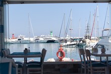 View On Marina With White Yachts Through The Restaurant
