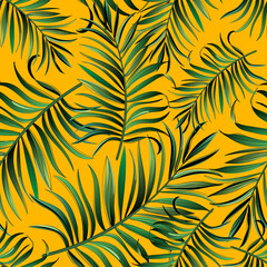 Green tropical palm leaves seamless vector pattern on the black background.Trendy summer print.