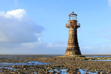 Wall Mural - Whiteford Lighthouse is listed by Cadw as Grade II* A wave-swept cast-iron lighthouse in British coastal waters and an important work of cast-iron engineering and nineteenth-century architecture.