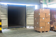 © ekkaluck - loading shipment carton boxes and goods on wooden pallet at loading dock from container