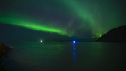 Wall Mural - brilliant aurora borealis reflecting in ocean water over ships iceland