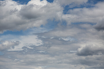 Wall Mural - Image of a partly cloudy and partly clear sky during the day