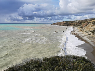 A sunny day in Petra tou Roumiou Beach and a storm approaching Cyprus Island.