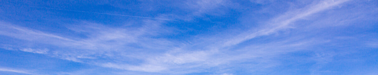 Wall Mural - Image of a partly cloudy and partly clear sky during the day