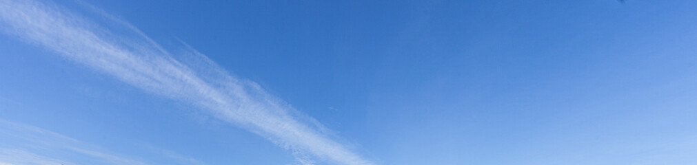 Wall Mural - Image of a partly cloudy and partly clear sky during the day