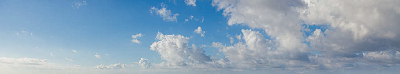 Wall Mural - Image of a partly cloudy and partly clear sky during the day