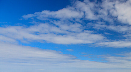 Wall Mural - Image of a partly cloudy and partly clear sky during the day