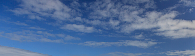 Wall Mural - Image of a partly cloudy and partly clear sky during the day