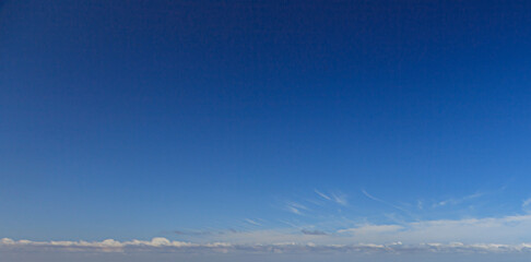 Wall Mural - Image of a partly cloudy and partly clear sky during the day