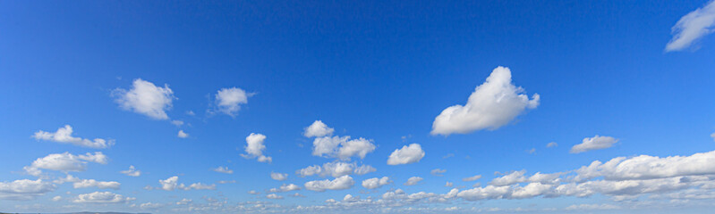 Wall Mural - Image of a partly cloudy and partly clear sky during the day