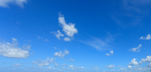 Wall Mural - Image of a partly cloudy and partly clear sky during the day