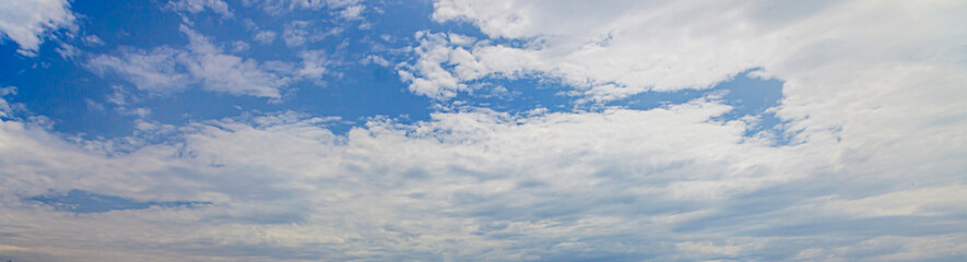 Wall Mural - Image of a partly cloudy and partly clear sky during the day