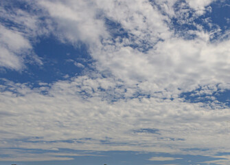 Wall Mural - Image of a partly cloudy and partly clear sky during the day