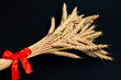 © Вячеслав Козырев - The screen shows a bunch of wheat ears tied with a festive ribbon. Golden harvest.