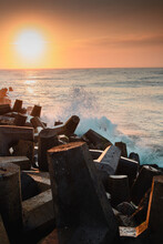 Concrete Wave Breaker With The North Sea Ocean In The Background With Colorful Sunset Light, Denmark
