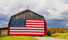 American Flag Painted On A Farm Barn During Fall Foliage Season In New England
