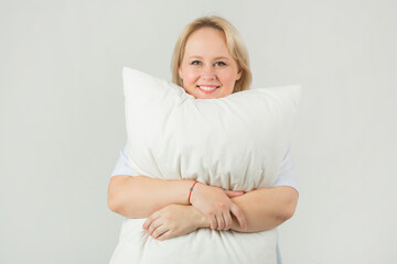 Wall Mural - beautiful young plump female in a white t-shirt on a white background