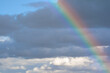 © Fernando - Rainbow formed after rain with clouds and blue sky in the background