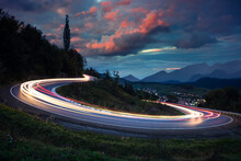 Long Exposure - Lights On The Asphalt, At Night On A Mountain Road