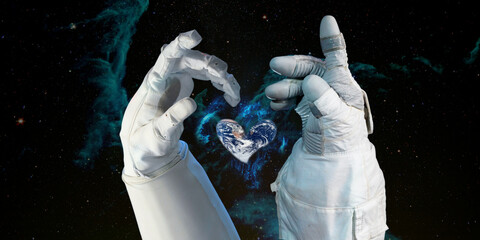 Wall Mural - earth heart in astronaut hands in space background, among stars and galaxies, world environment day 